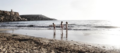 Berta, Nicki and Milla playing around in the surf on the beach, February, Golden Sands, Malta