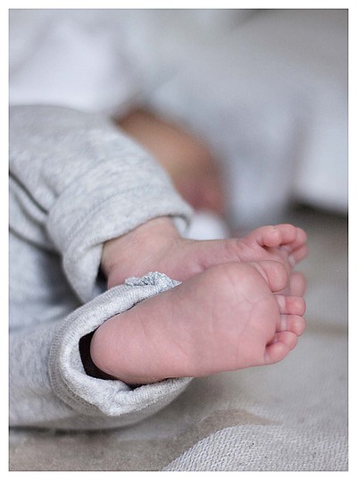 Close up photo in colour of new born baby's feet
