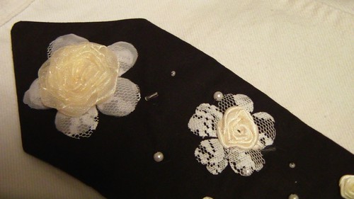 Necktie decorated with beads and satin roses.